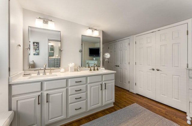 522 Trabert Ave NW, Atlanta, GA 30309 - bathroom featuring double vanity and wood finished floors