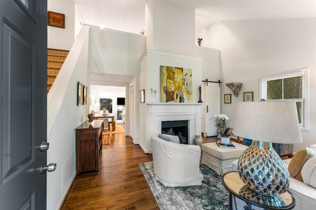 522 Trabert Ave NW, Atlanta, GA 30309 - living room with dark wood-type flooring, high vaulted ceiling, and a fireplace