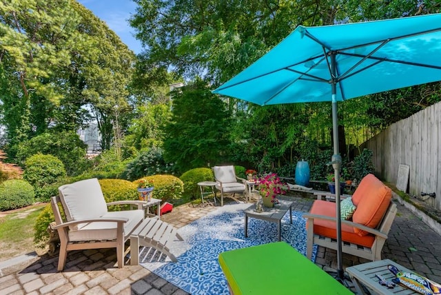 522 Trabert Ave NW, Atlanta, GA 30309 - view of patio / terrace with an outdoor living space and view of scattered trees