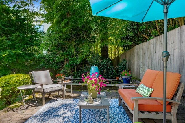 522 Trabert Ave NW, Atlanta, GA 30309 - fenced backyard featuring a patio and an outdoor hangout area