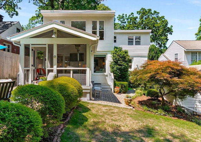 522 Trabert Ave NW, Atlanta, GA 30309 - view of front of home featuring a sunroom and a patio