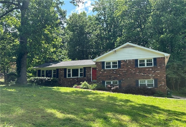 5669 Hillcrest Dr, Acworth, GA 30102 - tri-level home featuring a front yard and brick siding
