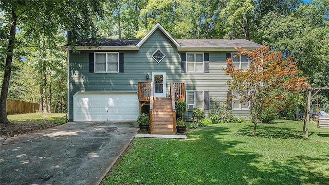 bi-level home featuring a front yard and a garage