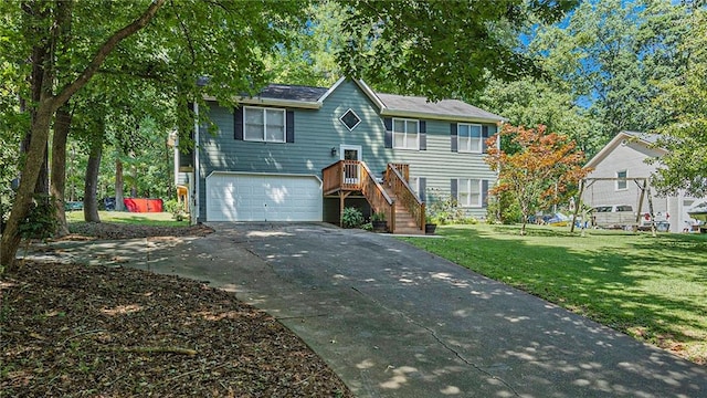 view of front of home with a front lawn and a garage