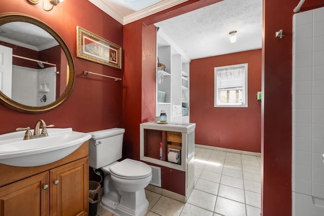 bathroom with tile patterned floors, toilet, ornamental molding, a textured ceiling, and a shower