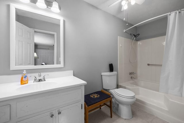 bathroom with toilet, tile patterned flooring, shower / bath combination with curtain, ceiling fan, and vanity