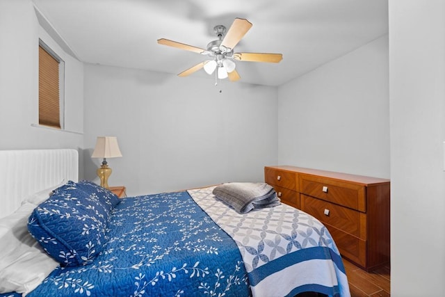 bedroom featuring wood finished floors and a ceiling fan