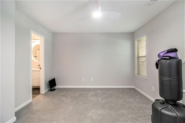 2376 Wellington Cir, Lithonia, GA 30058 - unfurnished bedroom featuring carpet, ceiling fan, and ensuite bathroom