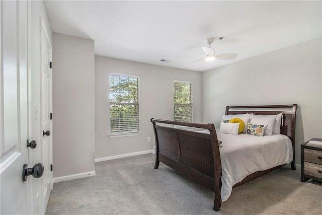 2376 Wellington Cir, Lithonia, GA 30058 - carpeted bedroom featuring baseboards and ceiling fan