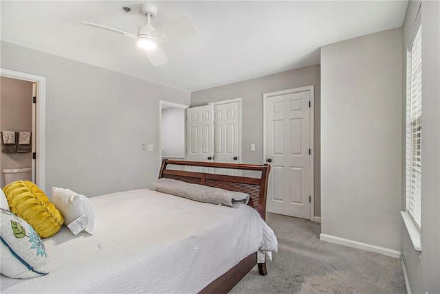 2376 Wellington Cir, Lithonia, GA 30058 - carpeted bedroom featuring baseboards and ceiling fan