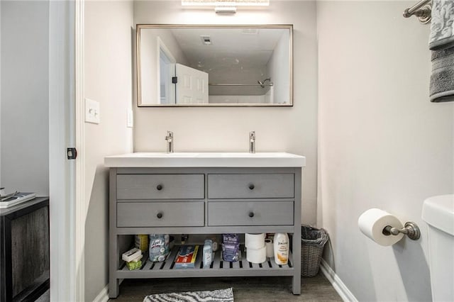 2376 Wellington Cir, Lithonia, GA 30058 - bathroom featuring double vanity and baseboards