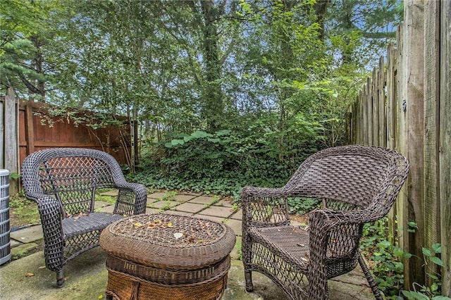 2376 Wellington Cir, Lithonia, GA 30058 - fenced backyard with a patio area