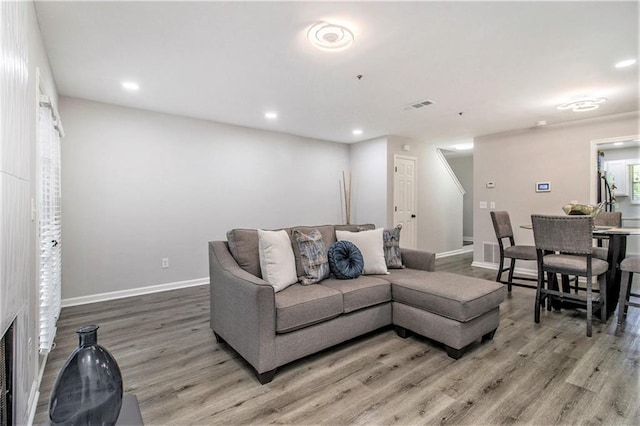 2376 Wellington Cir, Lithonia, GA 30058 - living room with light wood finished floors and recessed lighting