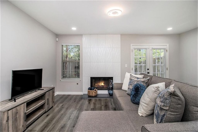 2376 Wellington Cir, Lithonia, GA 30058 - living area featuring wood finished floors, a large fireplace, recessed lighting, and french doors