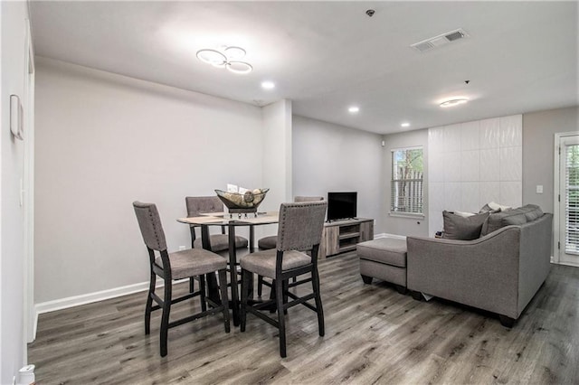 2376 Wellington Cir, Lithonia, GA 30058 - dining space featuring wood finished floors, recessed lighting, and plenty of natural light