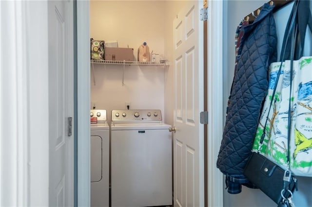 clothes washing area featuring independent washer and dryer