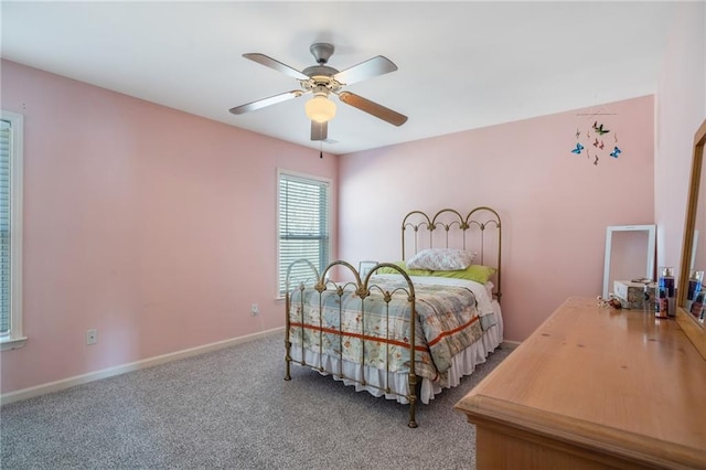 bedroom with carpet floors, a ceiling fan, and baseboards