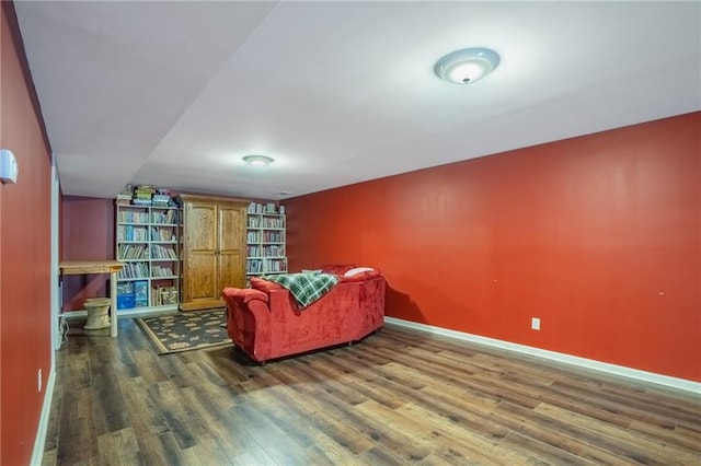 living area featuring dark wood-style floors and baseboards