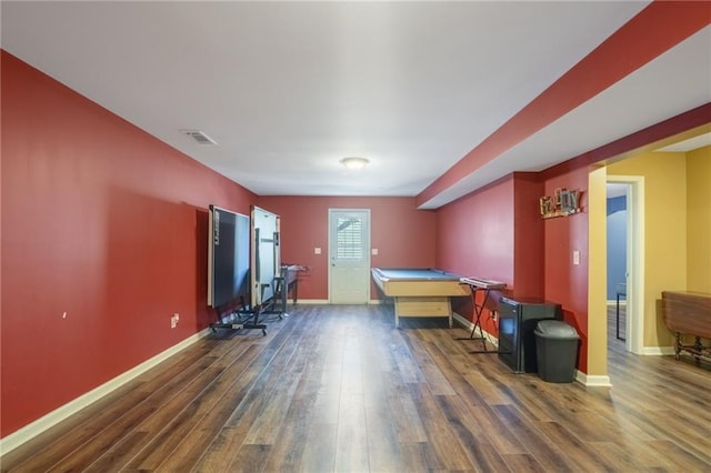 game room featuring dark wood finished floors, visible vents, and baseboards