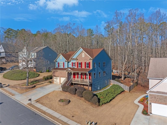 view of front of home with covered porch and a garage