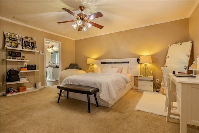 bedroom with ceiling fan, light colored carpet, ornamental molding, and ensuite bathroom