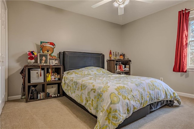 bedroom with ceiling fan and carpet floors