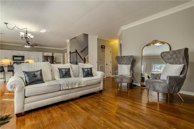 living room with dark hardwood / wood-style floors and ornamental molding