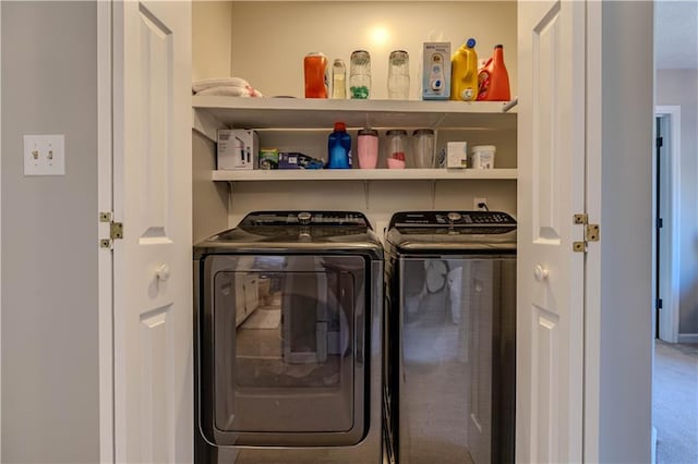 laundry room featuring washing machine and clothes dryer