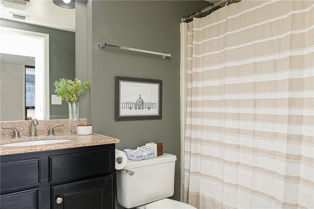 unfurnished bedroom featuring a walk in closet, carpet, baseboards, a closet, and a textured ceiling