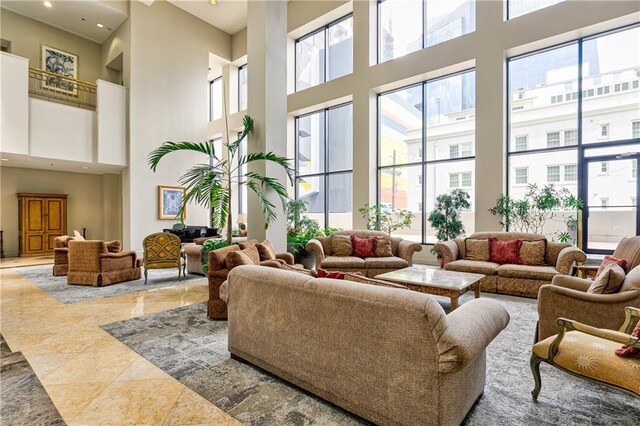 common area with a high ceiling and recessed lighting