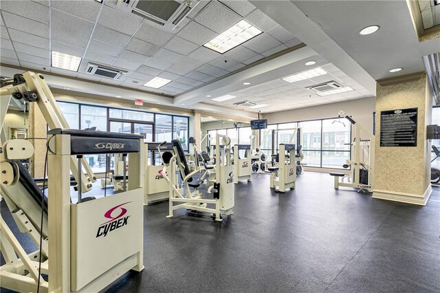 workout area with a paneled ceiling