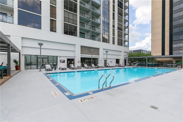 community pool with a patio