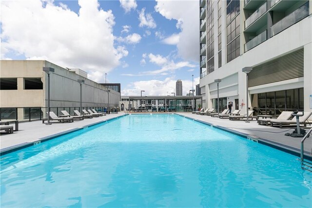 community pool with a patio area