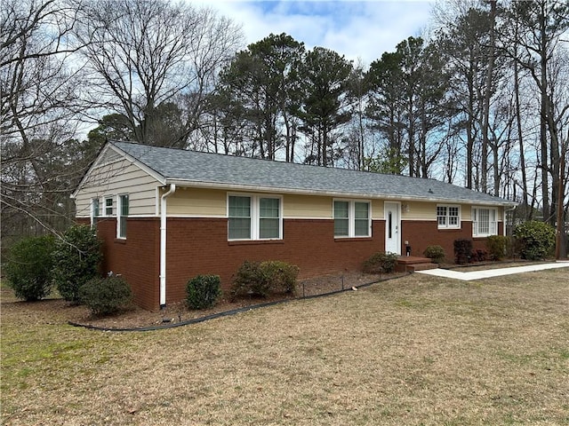 ranch-style home with a front lawn