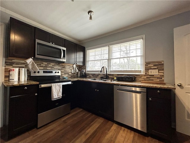 5862 Kitchens Rd SE, Mableton, GA 30126 - kitchen featuring sink, dark wood-type flooring, stainless steel appliances, light stone countertops, and decorative backsplash