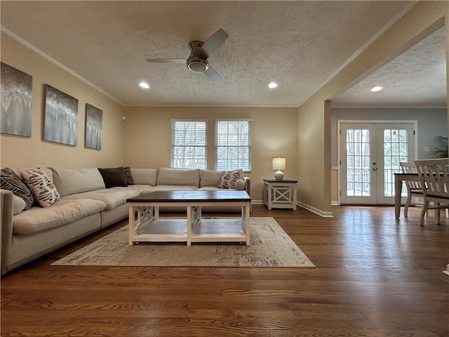 5862 Kitchens Rd SE, Mableton, GA 30126 - living room with dark hardwood / wood-style flooring, ornamental molding, ceiling fan, a textured ceiling, and french doors