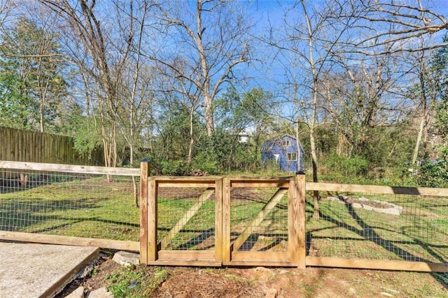 view of gate featuring fence