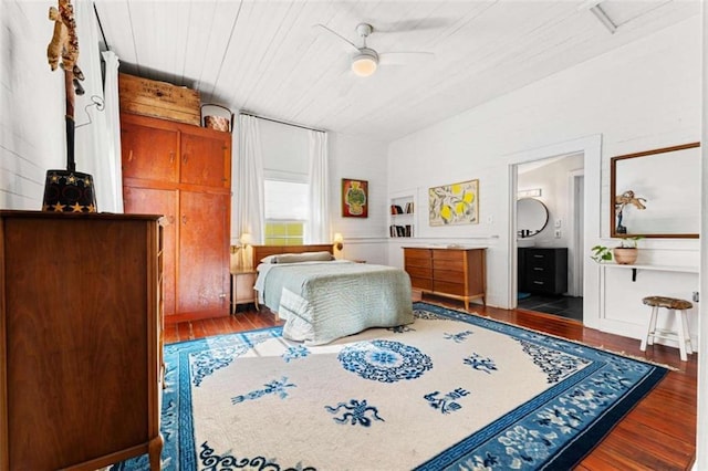 bedroom featuring wooden ceiling, ensuite bath, and wood finished floors