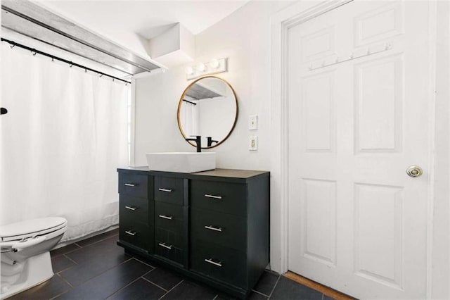 full bathroom with vanity, tile patterned floors, toilet, and a shower with shower curtain