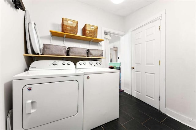 clothes washing area featuring independent washer and dryer and laundry area