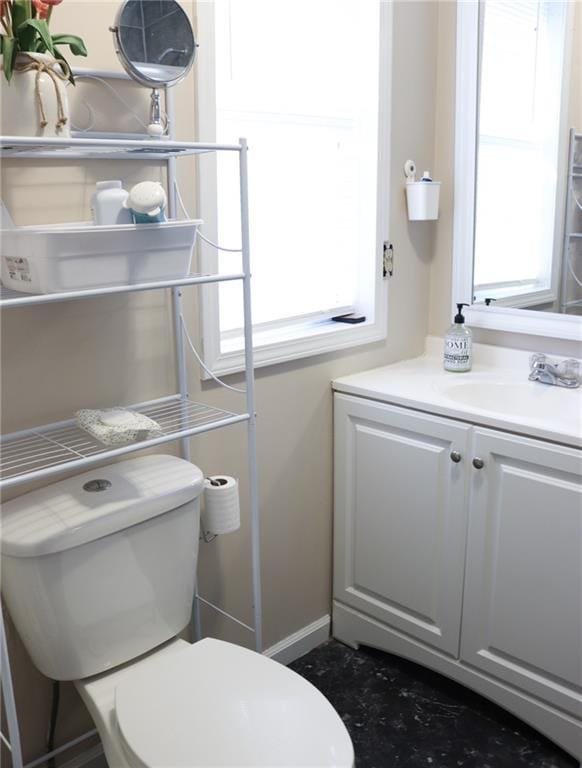 bathroom with vanity and toilet