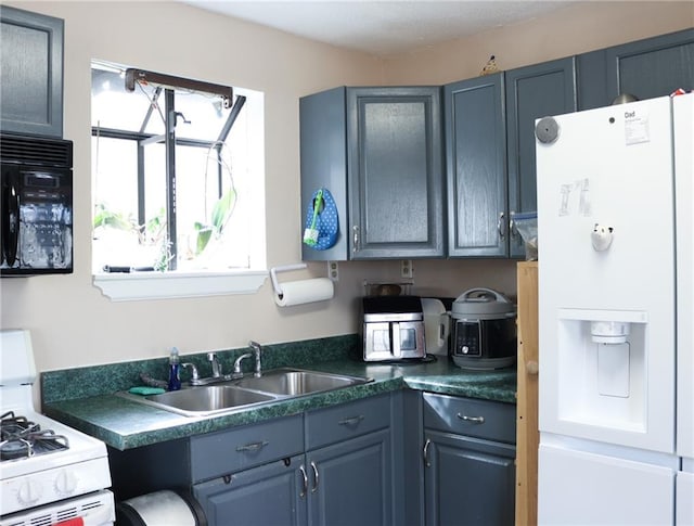 kitchen with sink and white appliances