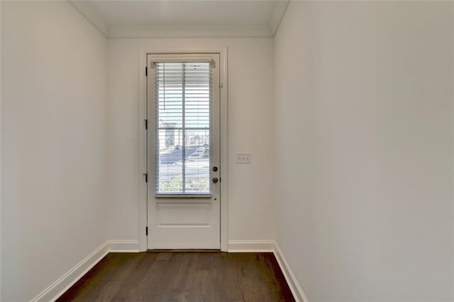 doorway with crown molding and dark hardwood / wood-style flooring