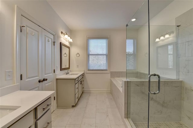 bathroom with vanity and separate shower and tub