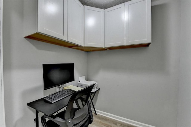 office space with light hardwood / wood-style flooring