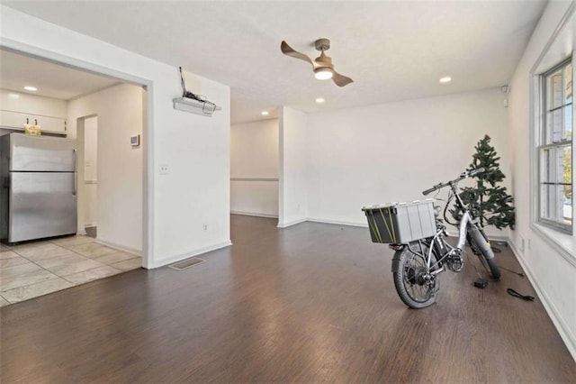 interior space featuring ceiling fan and light wood-type flooring