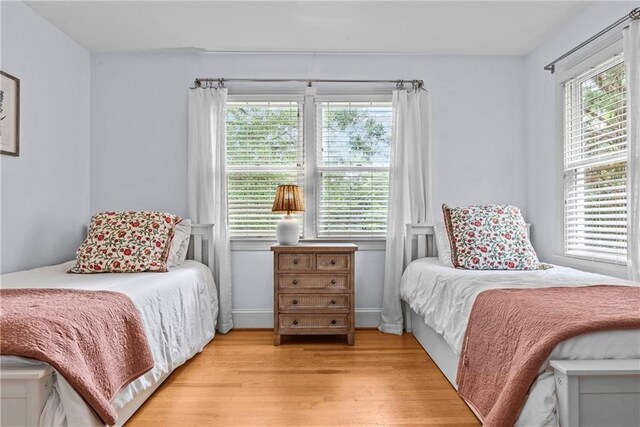 bedroom with light wood-type flooring