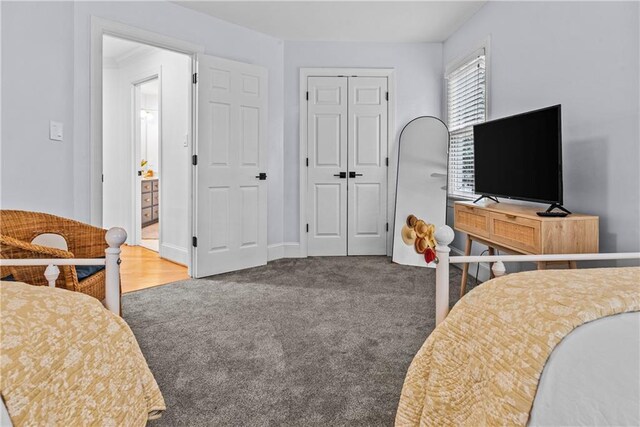 carpeted bedroom with a closet