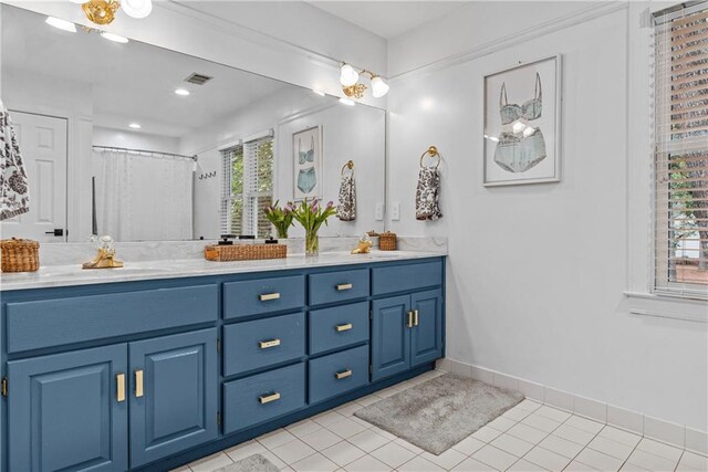 bathroom featuring a healthy amount of sunlight, a shower with curtain, vanity, and tile patterned floors