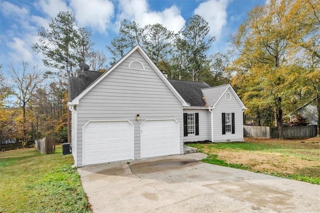 view of front facade with a front yard, central AC, and a garage